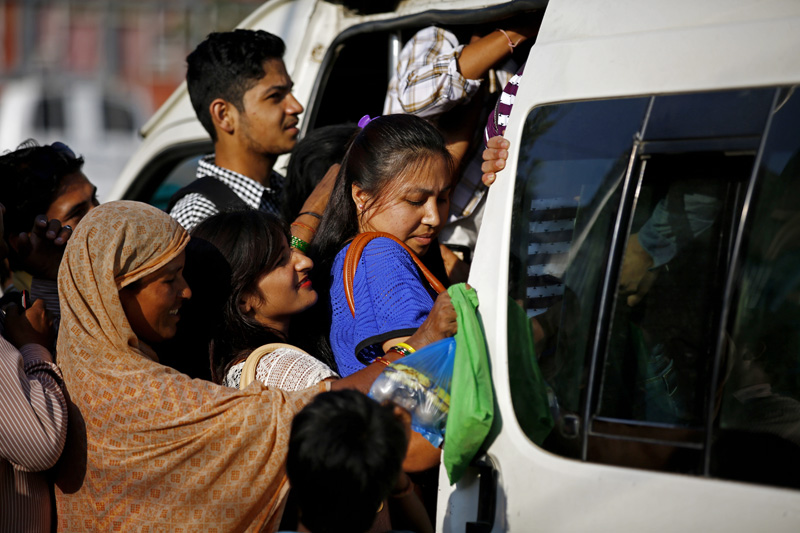 Passengers have a difficult time getting inside a public vehicle as fuel crisis